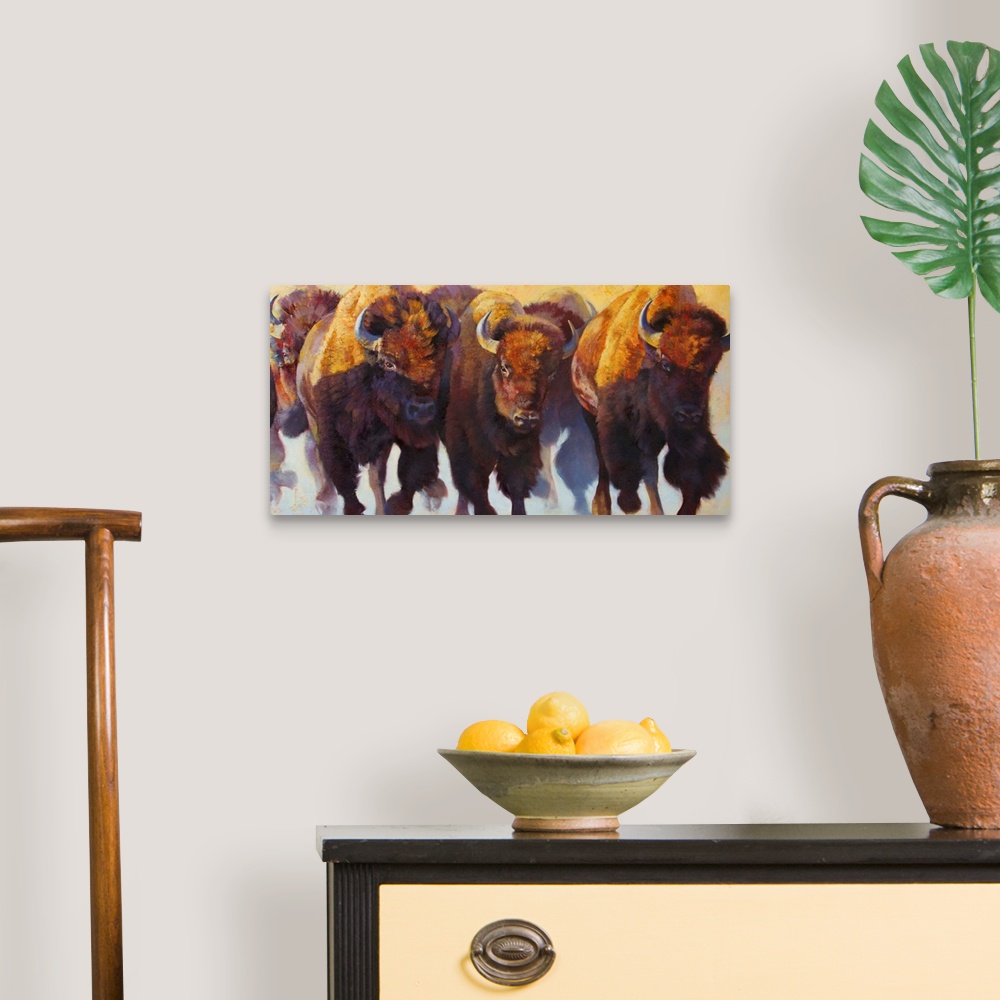 A traditional room featuring Painting on canvas of bison and buffalos running in a pack.