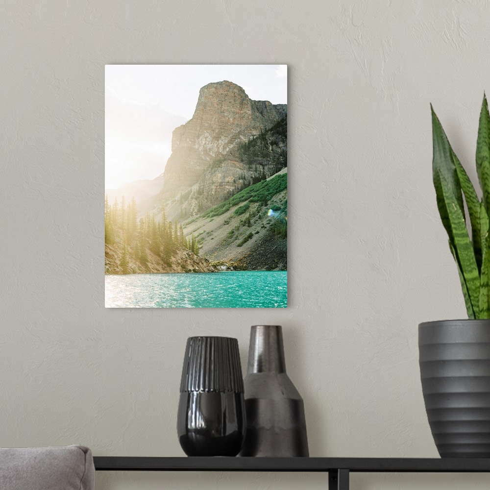 A modern room featuring Photograph of the sun rising over the edge of Moraine Lake, Banff, Canada.