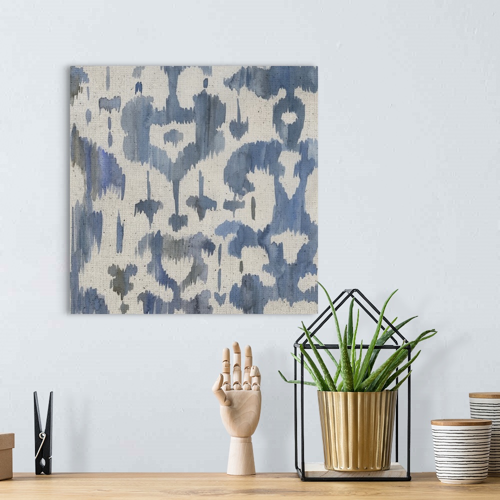A bohemian room featuring Watercolor painting of decorative patterns in shades of blue and gray on a textured linen backdrop.