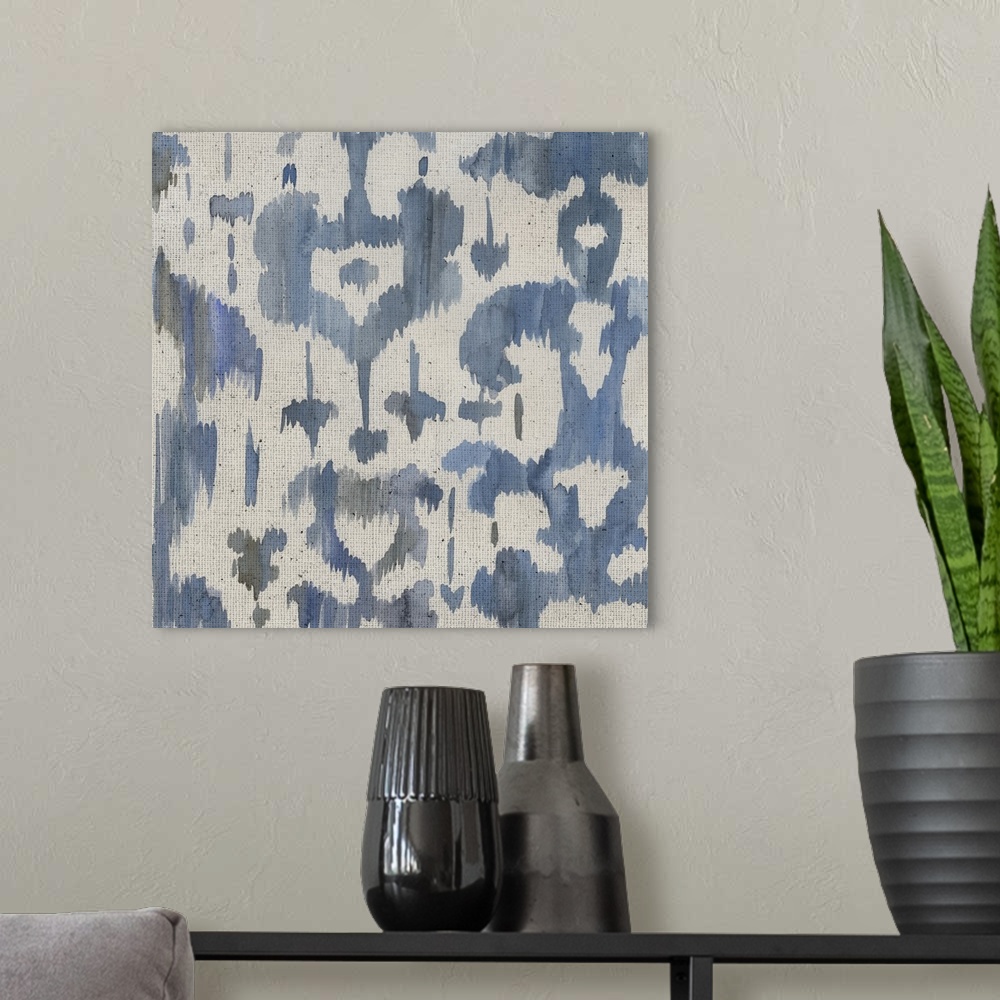 A modern room featuring Watercolor painting of decorative patterns in shades of blue and gray on a textured linen backdrop.