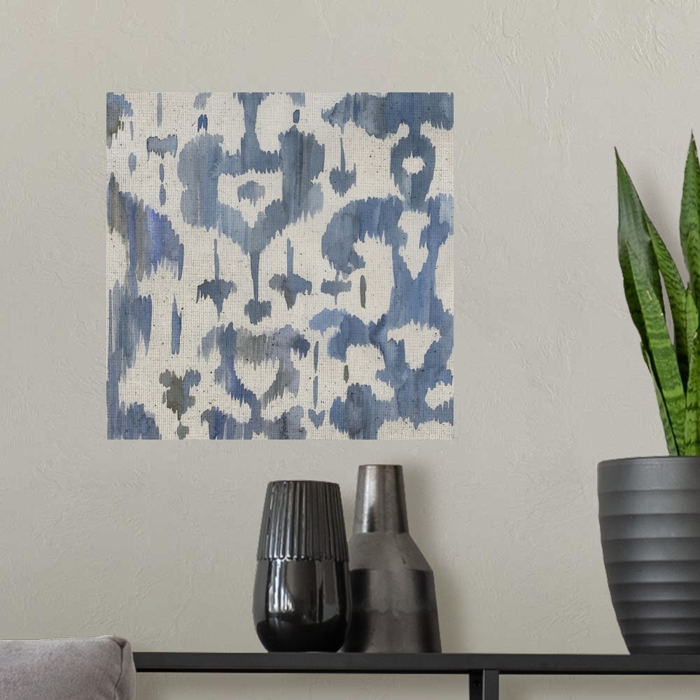 A modern room featuring Watercolor painting of decorative patterns in shades of blue and gray on a textured linen backdrop.