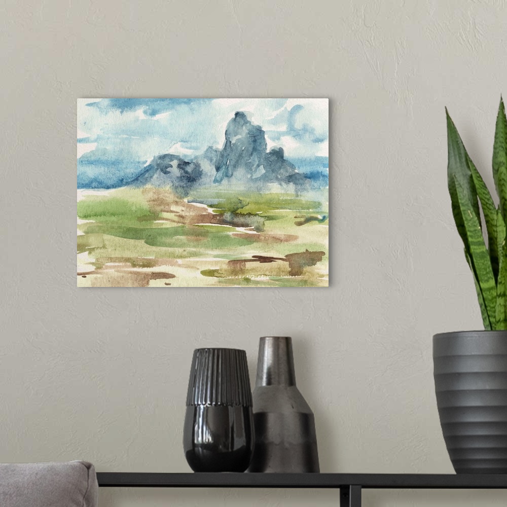 A modern room featuring Contemporary watercolor landscape of a field and a mountain in the distance.