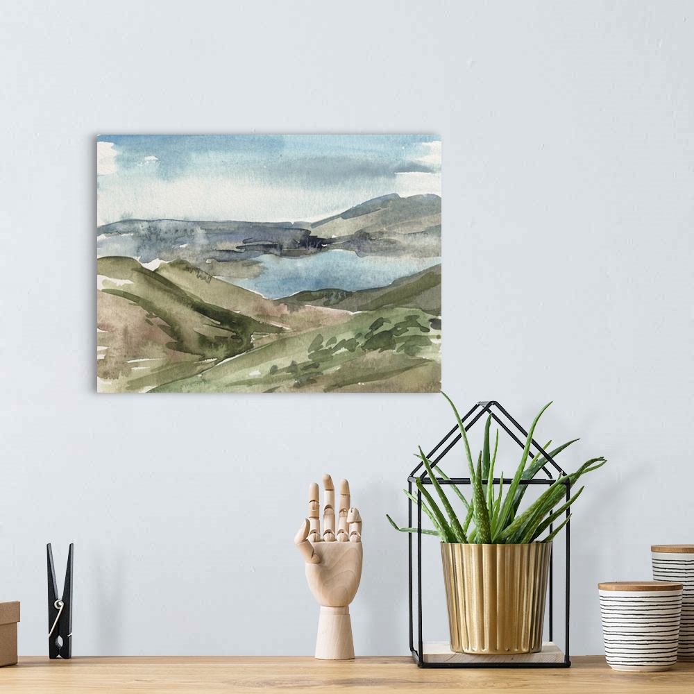 A bohemian room featuring Contemporary watercolor landscape of a lake surrounded by a mountainous landscape.