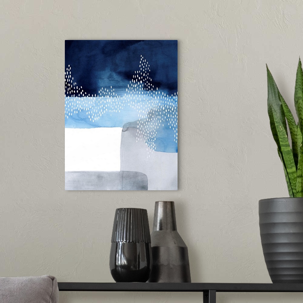 A modern room featuring Abstract watercolor painting of blocks of blue and grey color with a white dot pattern.