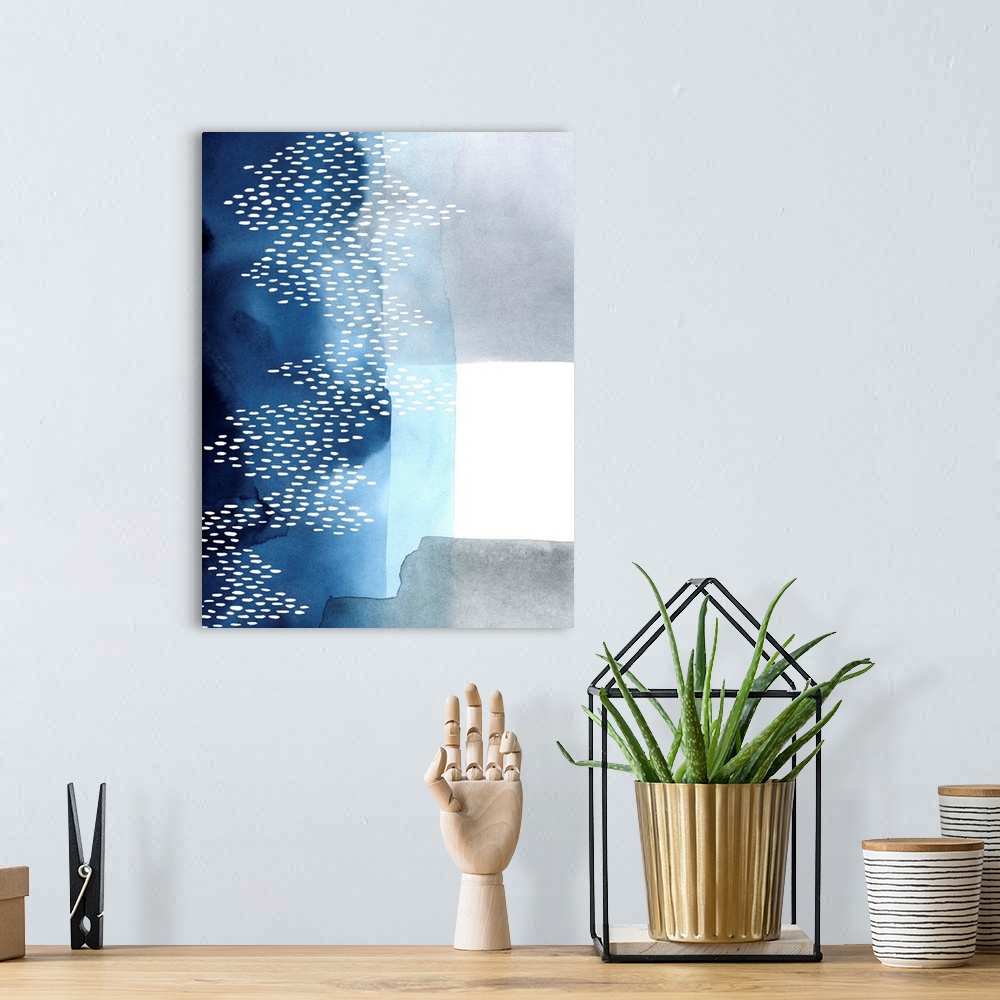 A bohemian room featuring Abstract watercolor painting of blocks of blue and grey color with a white dot pattern.