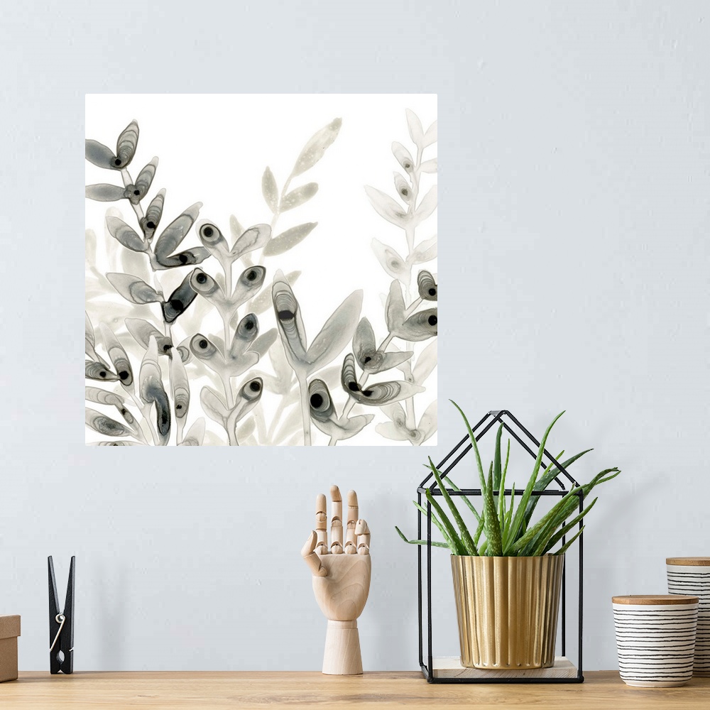 A bohemian room featuring Watercolor painting of silhouetted foliage made in shades of gray with darker black areas, on a s...