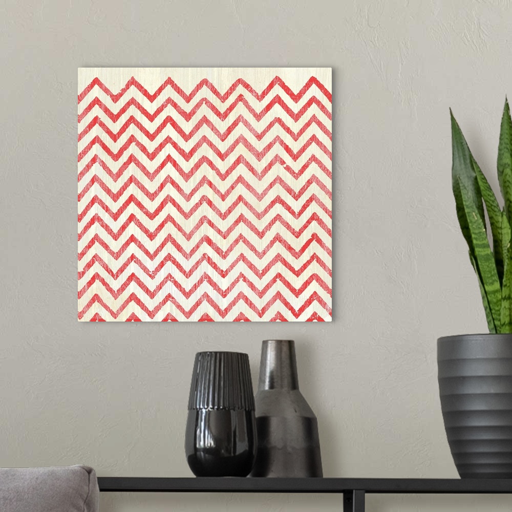 A modern room featuring Square decorative artwork of a repetitive pattern of a chevron design with a light streak overlay.