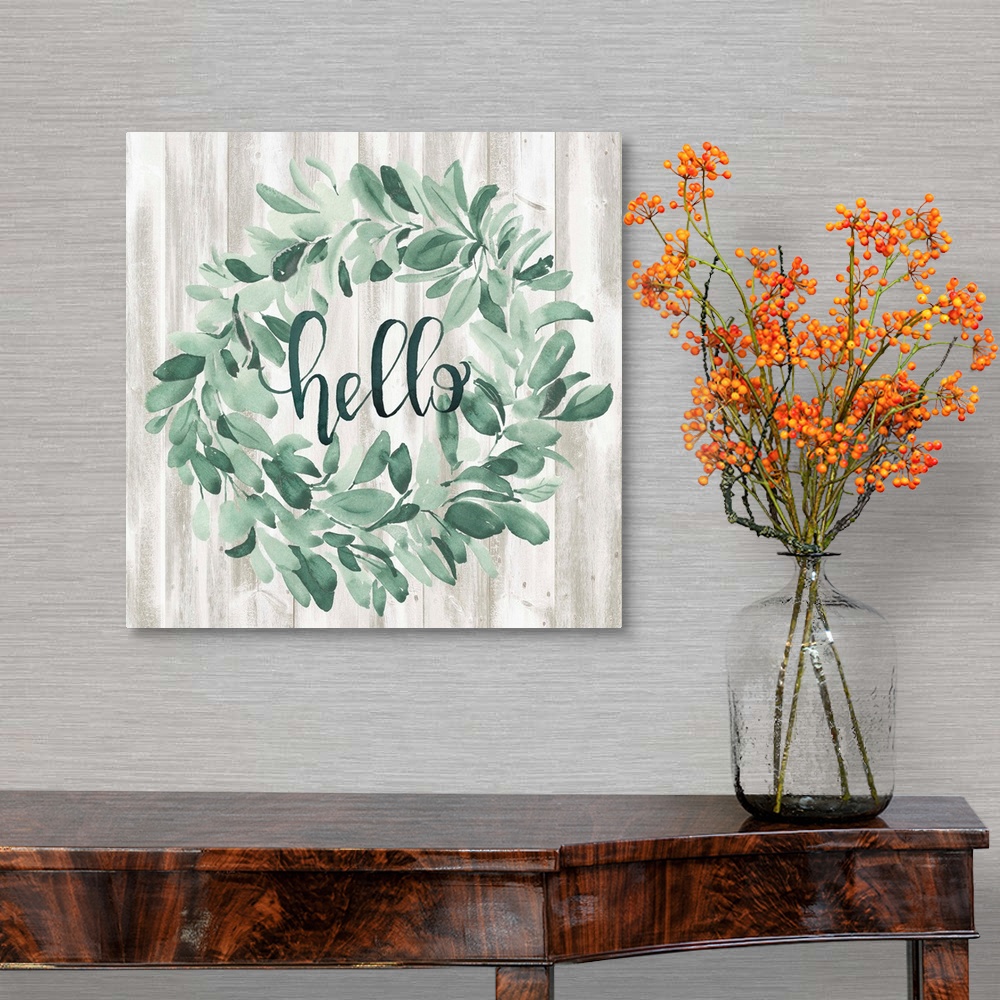 A traditional room featuring Watercolor wreath painting with script "Hello" in center.