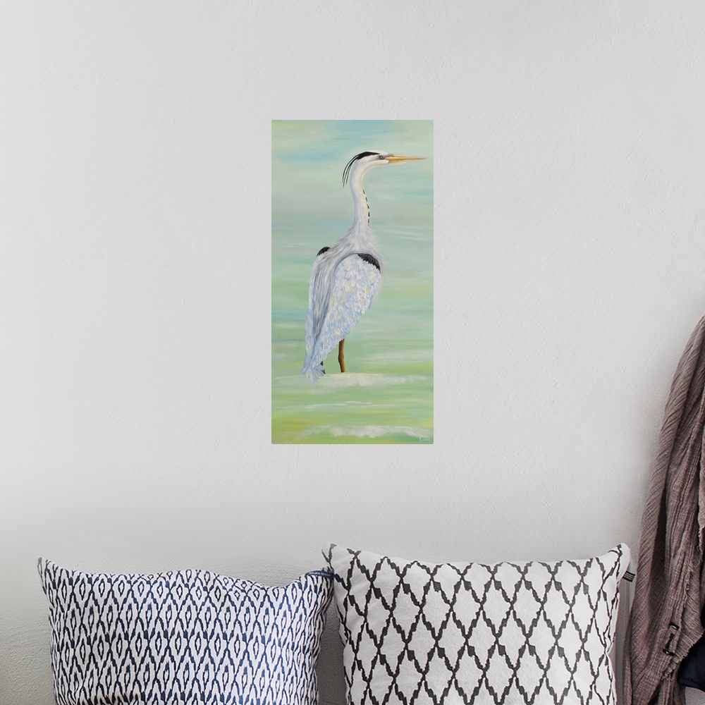 A bohemian room featuring Painting of a tall heron standing in shallow water.