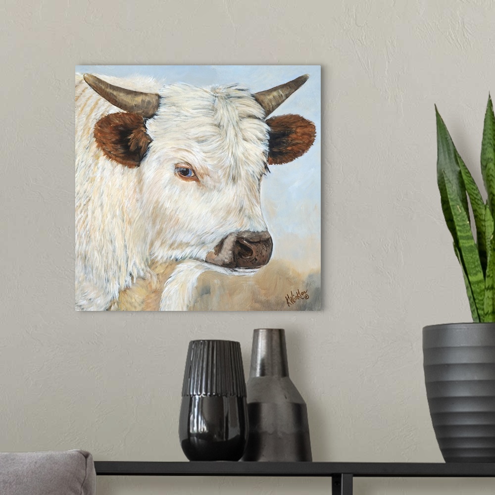 A modern room featuring Contemporary painting of a portrait of a white cow with large ears and short horns.
