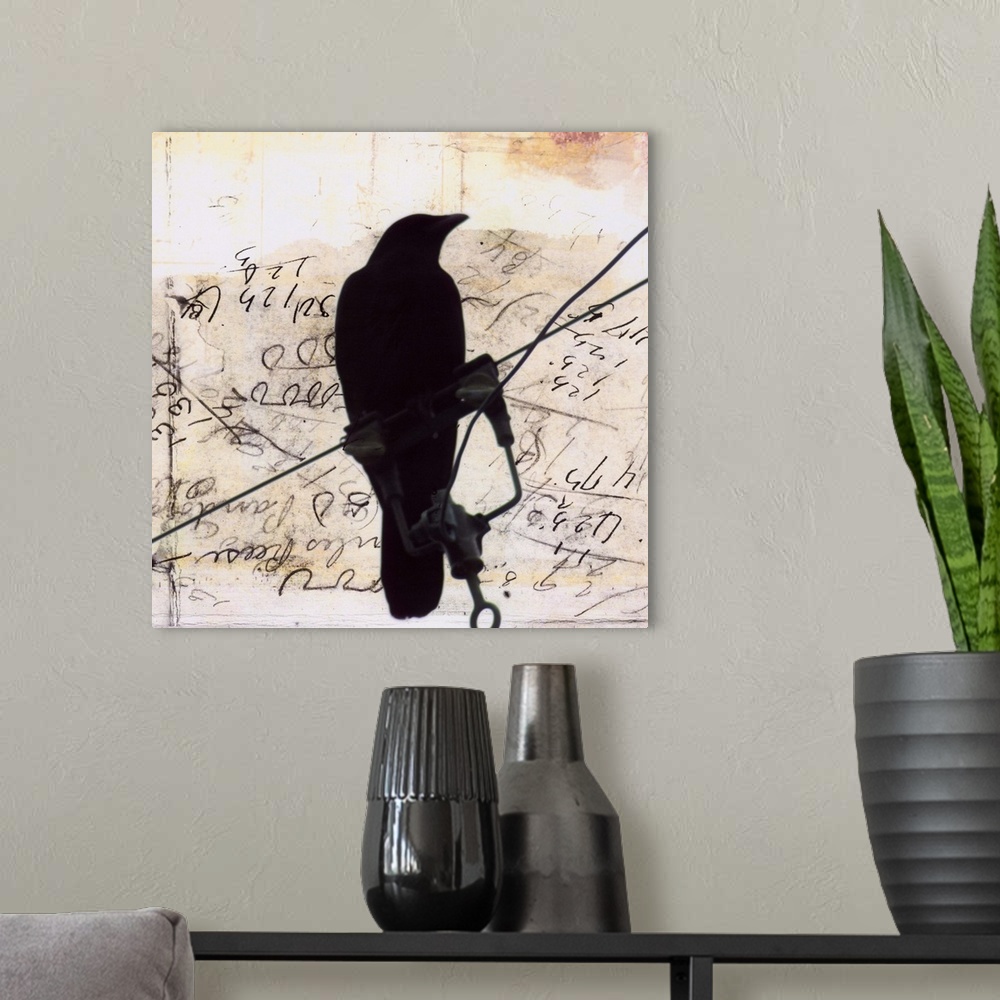 A modern room featuring Artwork of a silhouetted crow perched on a wire against a scribbled weathered piece of paper.