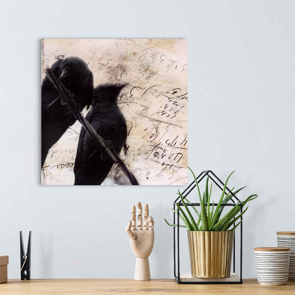 A bohemian room featuring Artwork of pair of silhouetted crows perched on a wire against a scribbled weathered piece of paper.