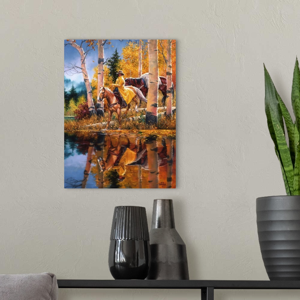 A modern room featuring Contemporary Western artwork of a rider on horseback at a riverbank near some aspen trees in the ...
