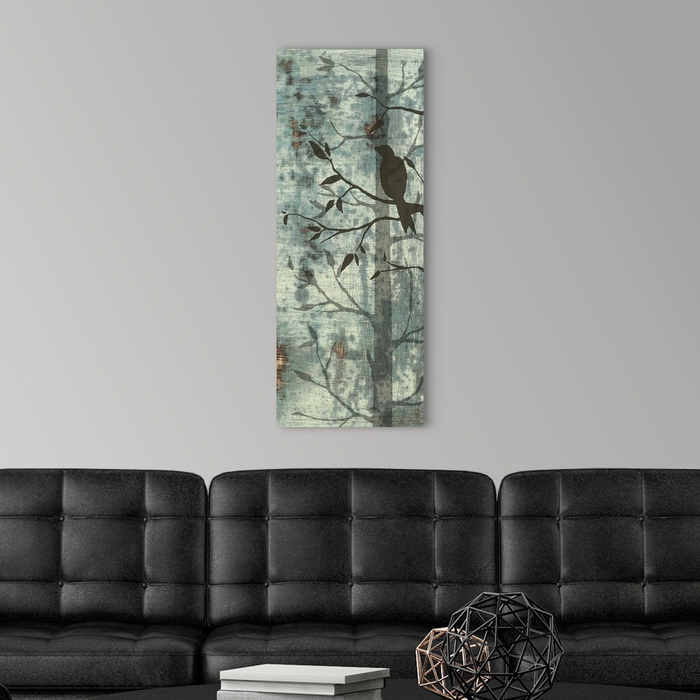 A modern room featuring Artwork of silhouetted birds and trees against a pale teal background.