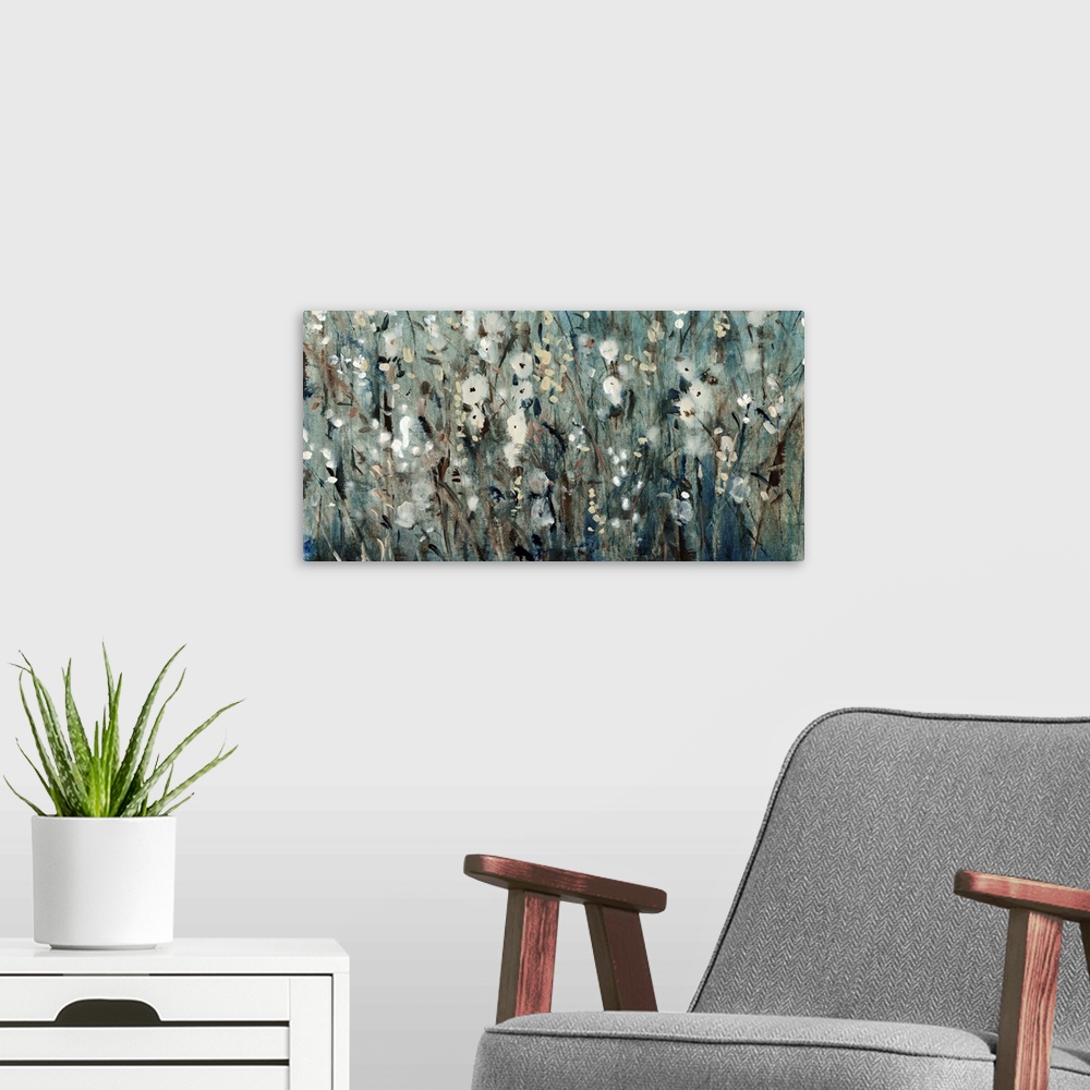 A modern room featuring Contemporary painting of several flowers in a field, in blue and grey tones.