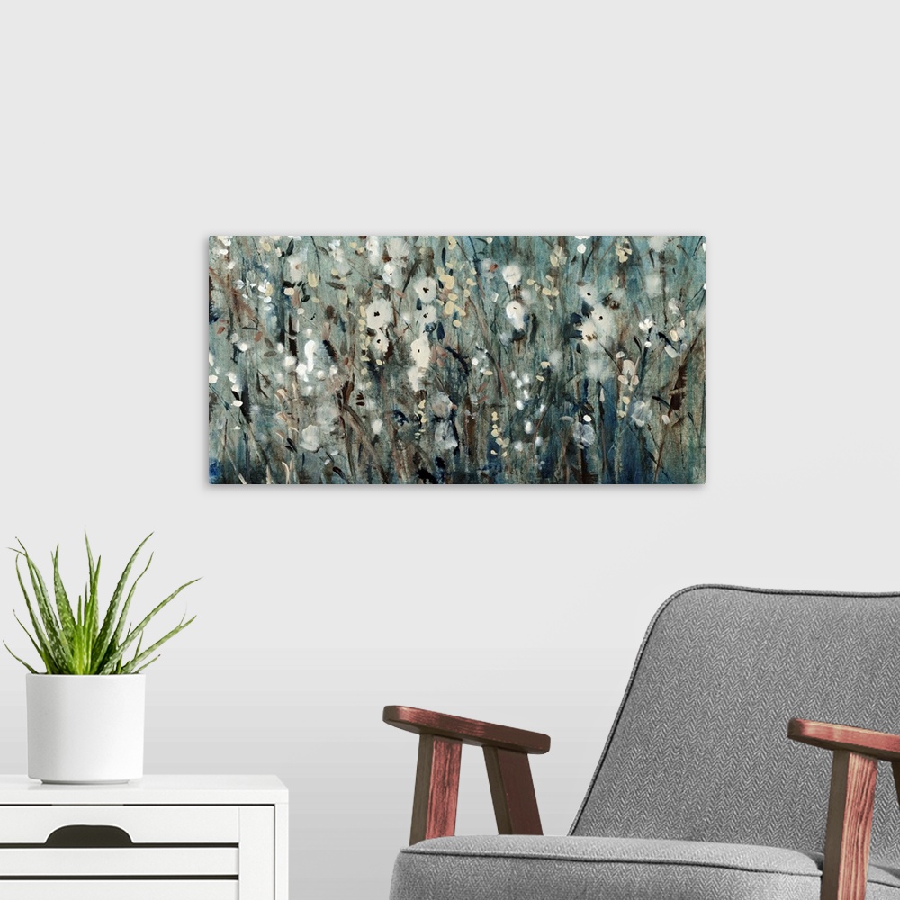 A modern room featuring Contemporary painting of several flowers in a field, in blue and grey tones.
