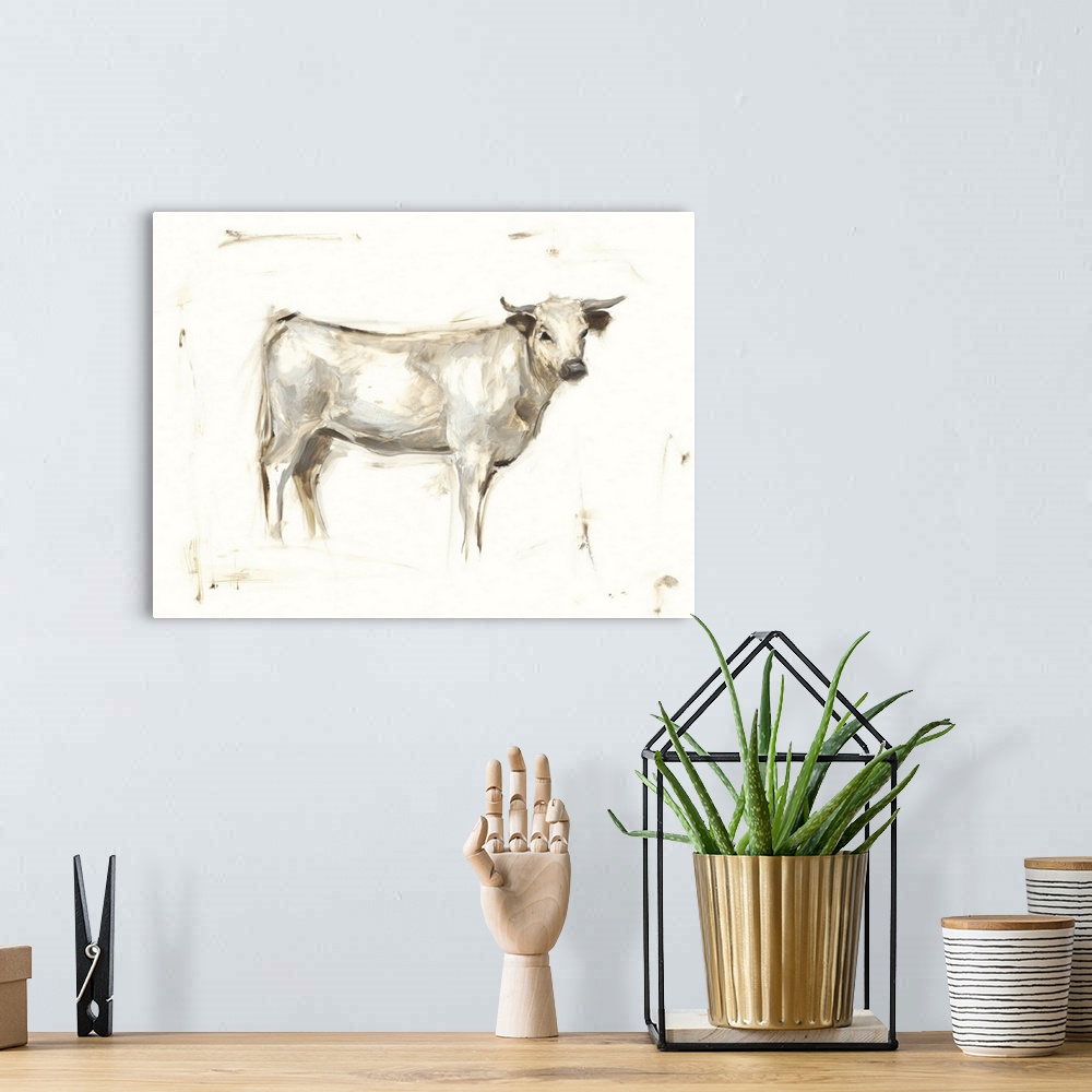 A bohemian room featuring Art print of a white cow with short horns.