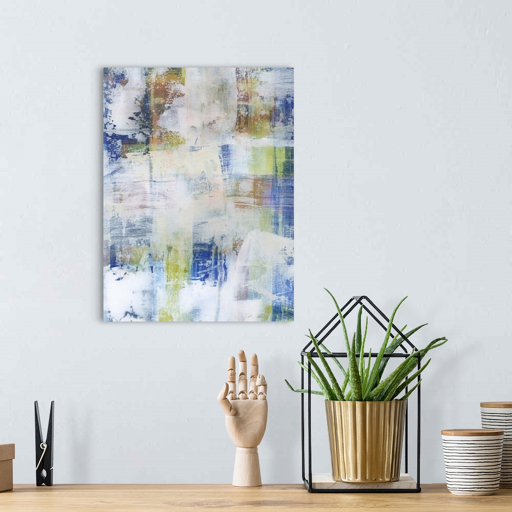A bohemian room featuring Contemporary abstract painting using blue tones with faded white in swiping motions.