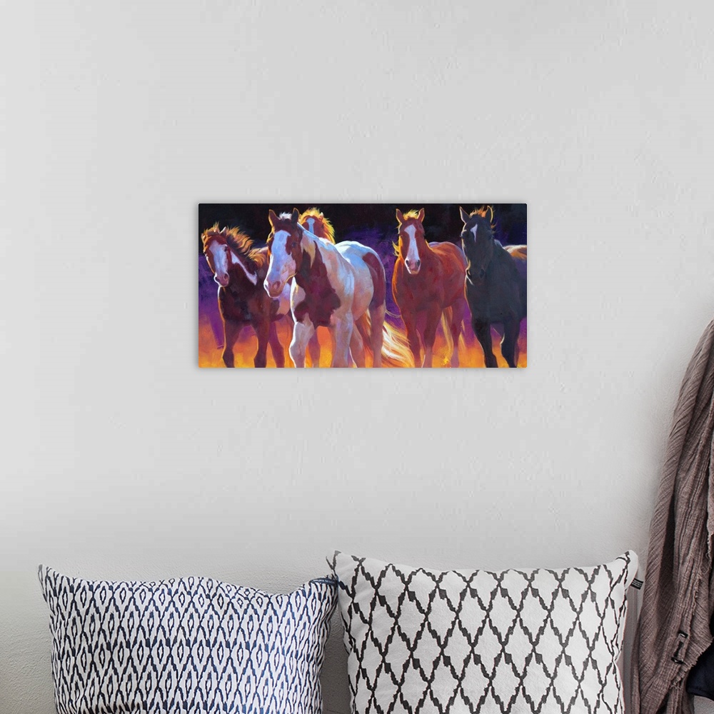 A bohemian room featuring Contemporary painting of wild horses running with a dark purple and orange background.