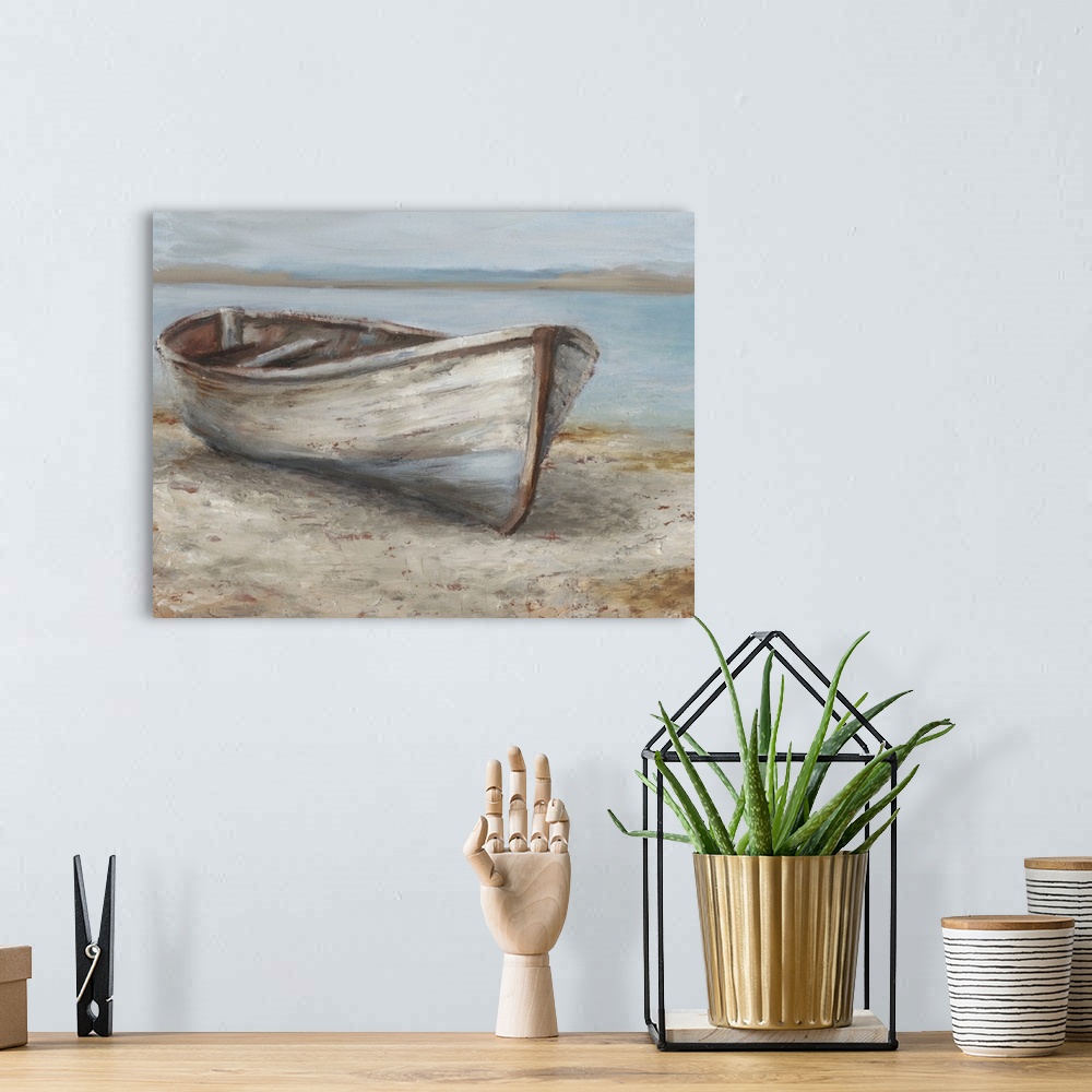 A bohemian room featuring A tranquil, coastal scene of an old wooden rowboat pulled up onto the sand. It features neutral t...