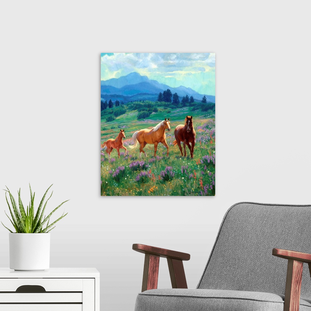 A modern room featuring Contemporary colorful painting of a herd of horses running through a meadow, with a mountain rang...