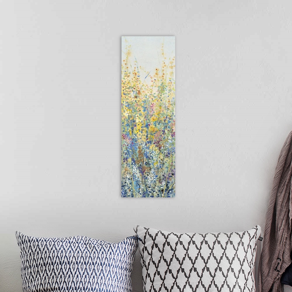 A bohemian room featuring Vertical panel of blooming yellow and blue wildflowers in a field.