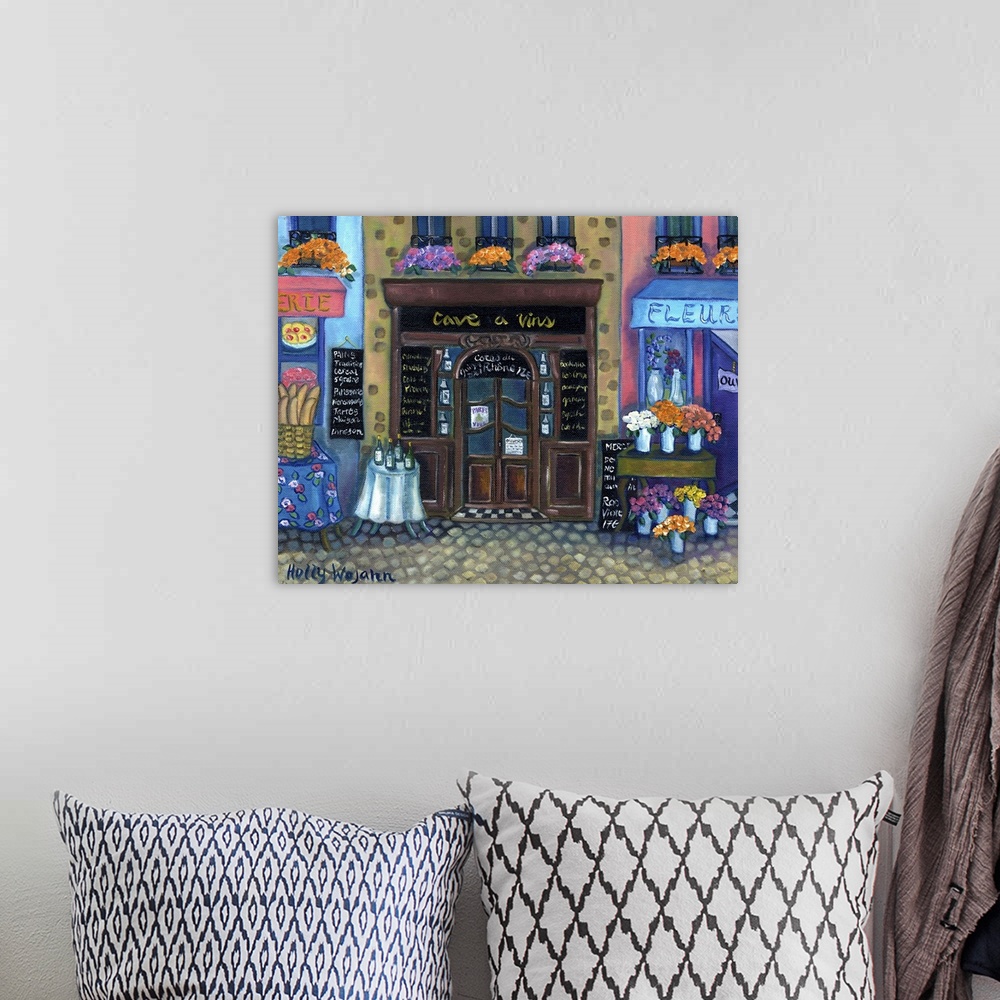 A bohemian room featuring Whimsical painting of a French marketplace next to a flower shop, with wine on the table.