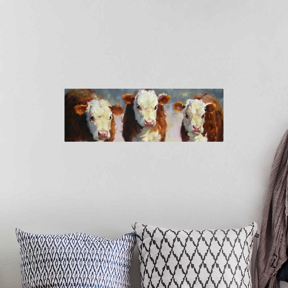 A bohemian room featuring Contemporary painting of three cows in the afternoon sunlight.