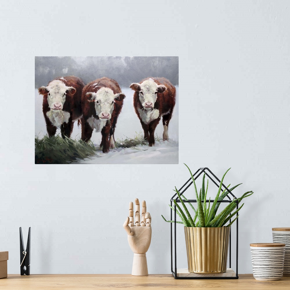 A bohemian room featuring Contemporary artwork of three brown and white cows in the snow.