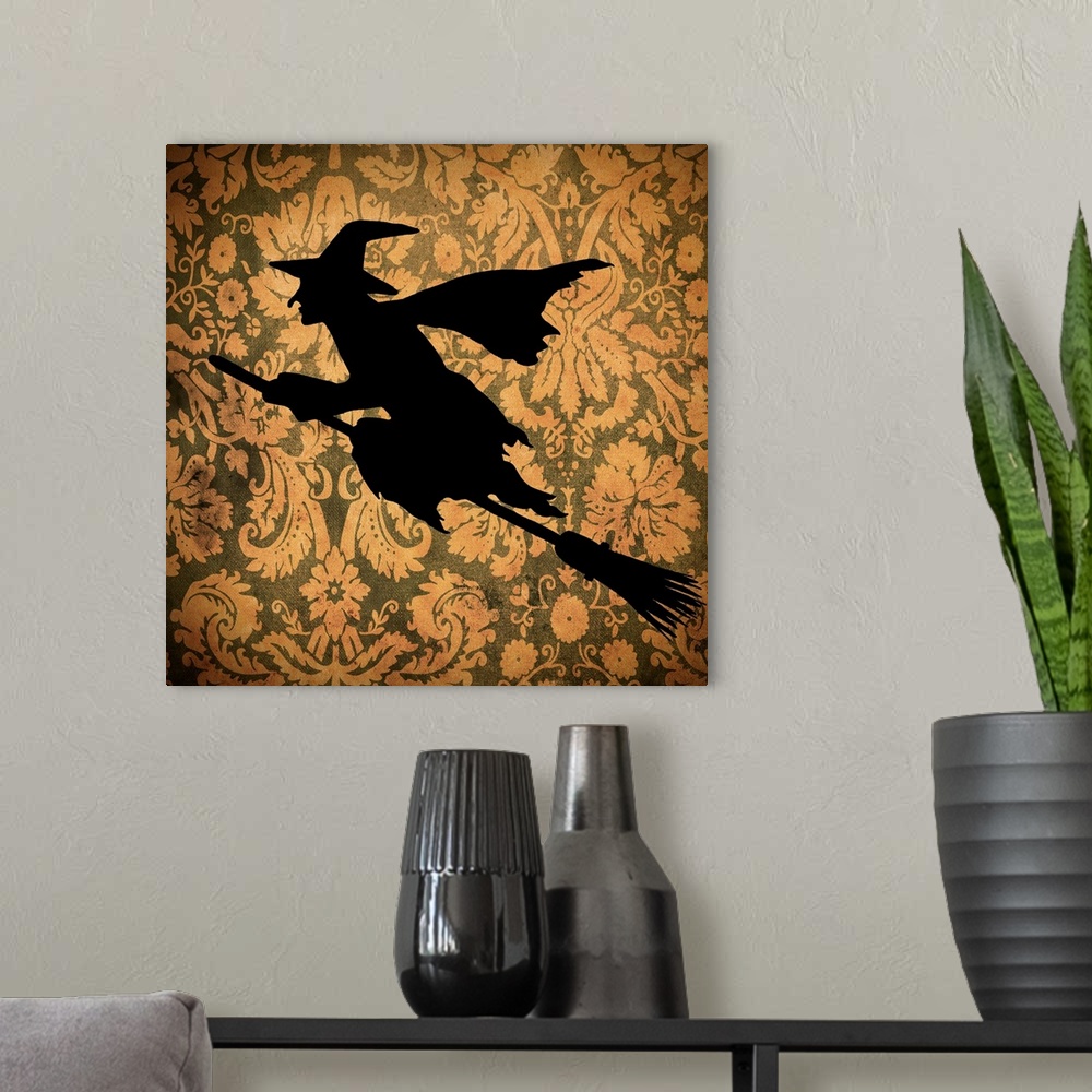 A modern room featuring Silhouette of a witch on an orange floral background.