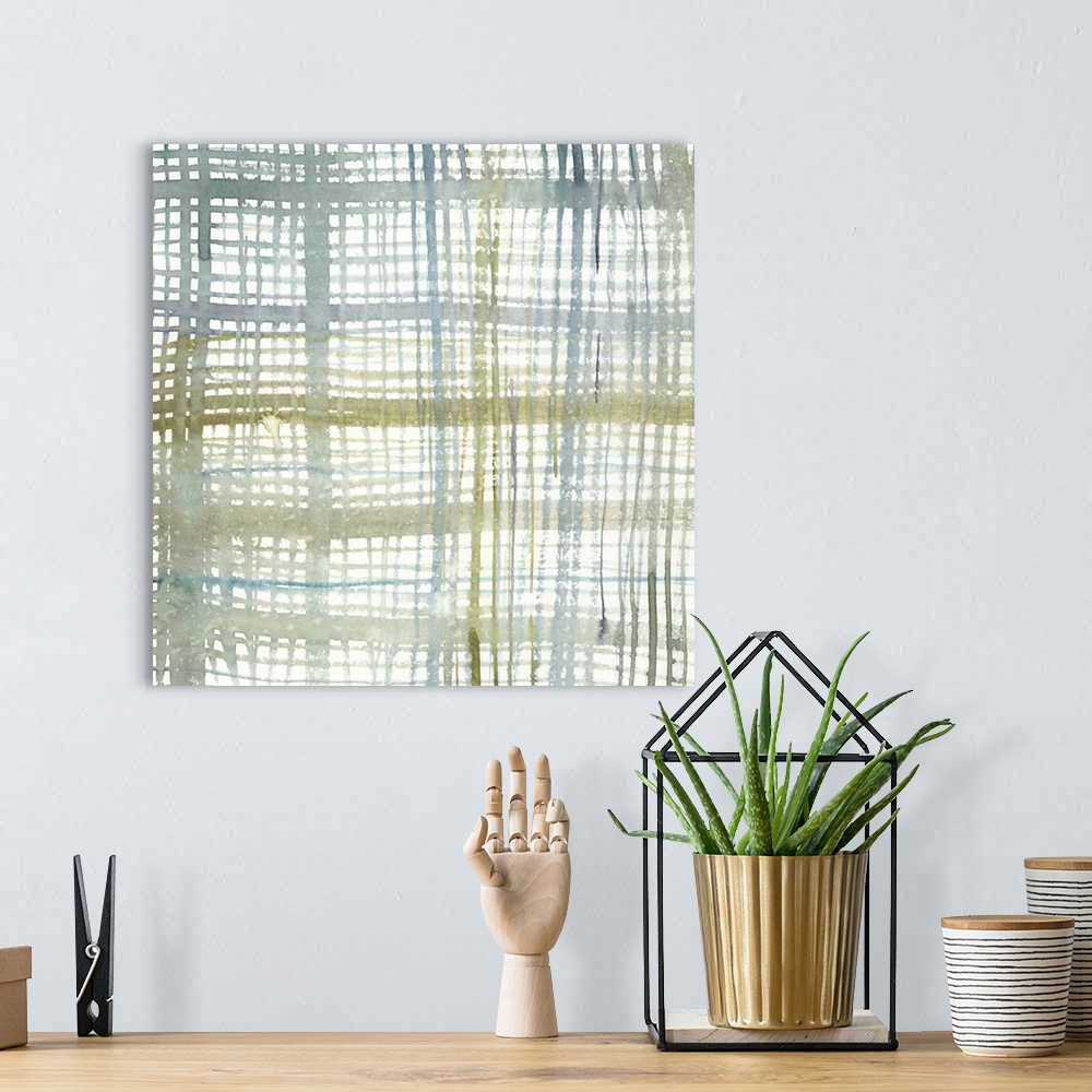 A bohemian room featuring Square abstract painting of a vertical and horizontal lines intercepting in a plaid design, in va...