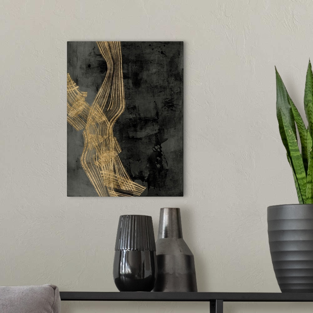 A modern room featuring Abstract contemporary artwork with gold wavy lines crossing through dark grey.