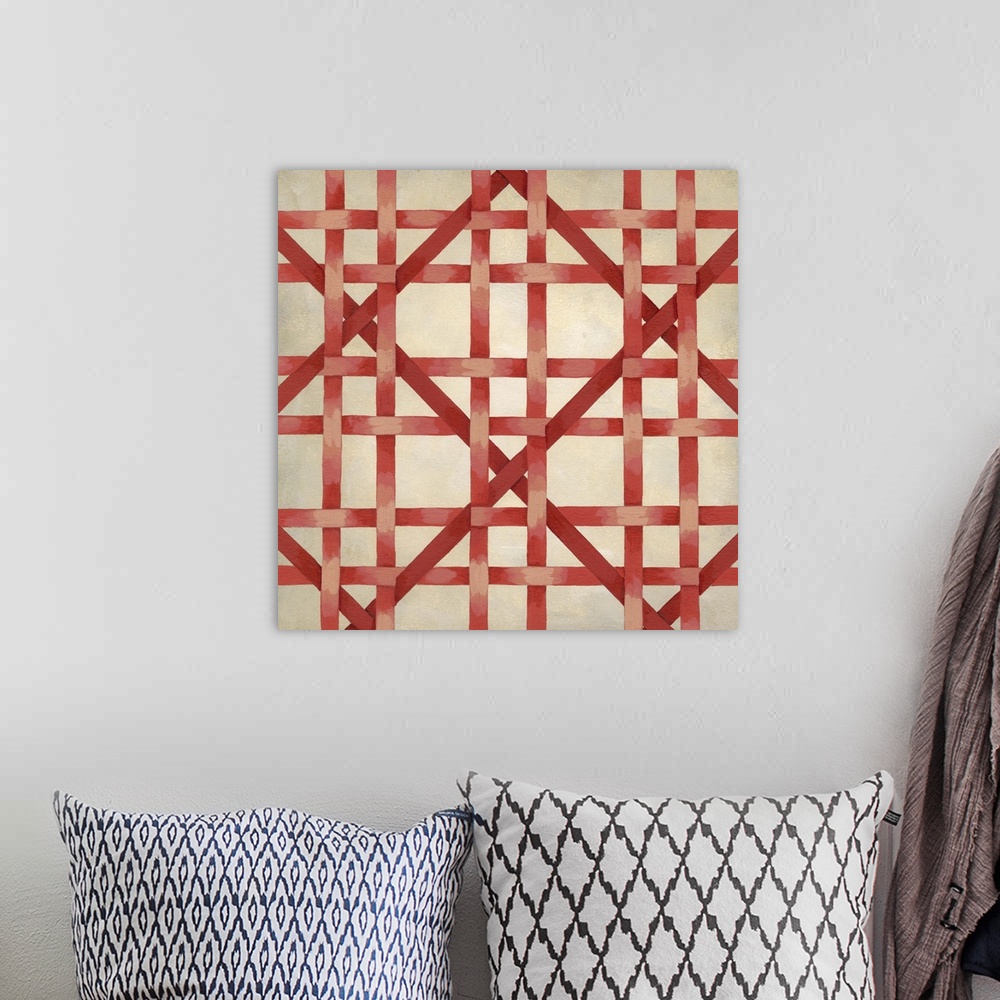 A bohemian room featuring Geometric artwork resembling woven fibers in bright colors.