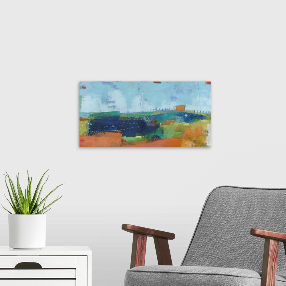 A modern room featuring Abstract modern art print in cheerful shades of blue, orange, and green.