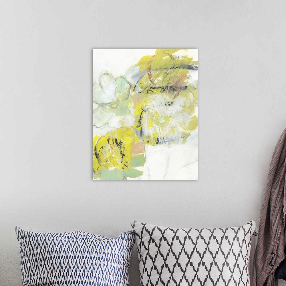 A bohemian room featuring Semi-abstract artwork of yellow and white flowers.
