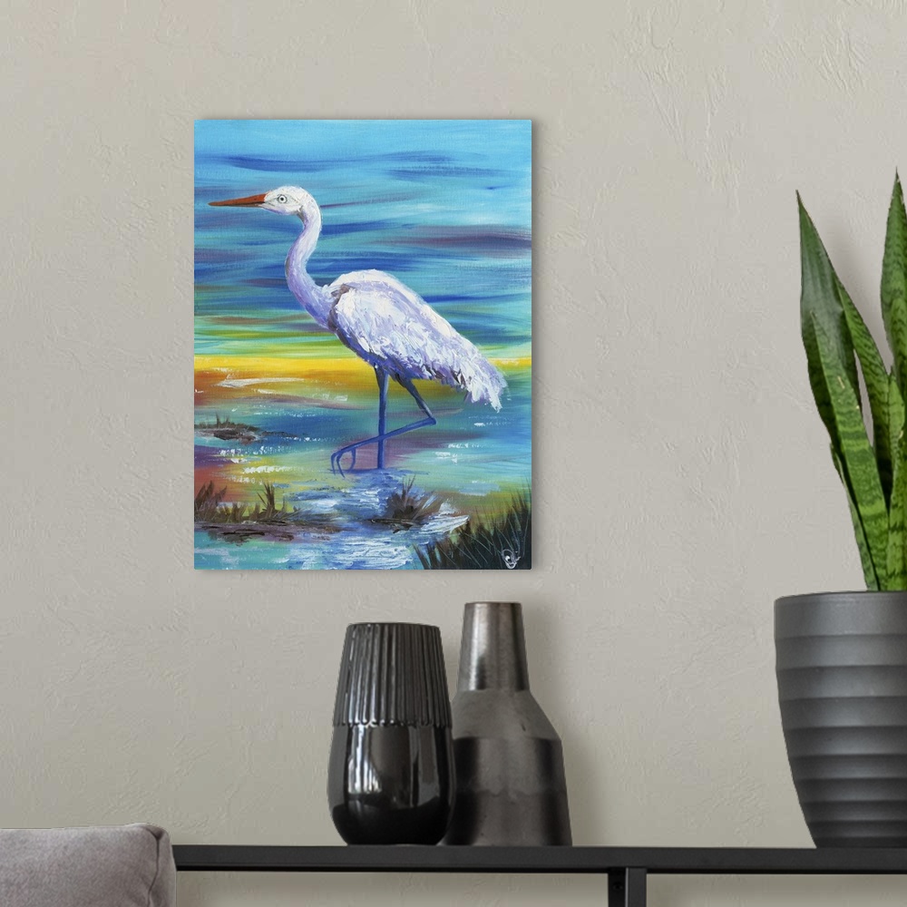 A modern room featuring Painting of a white egret standing in shallow water at sunset.