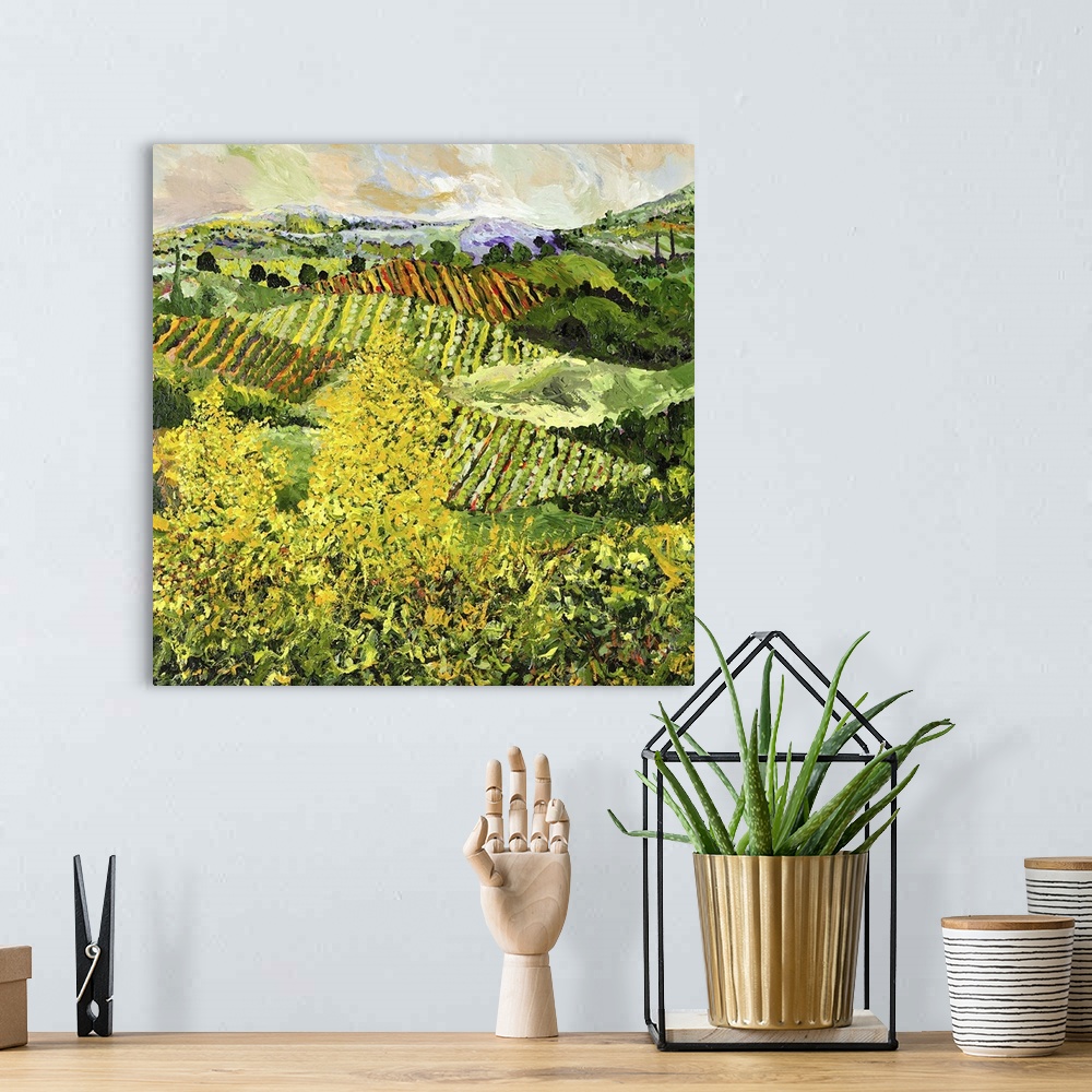 A bohemian room featuring Contemporary painting of a country landscape with two yellow trees looking over crops growing in ...