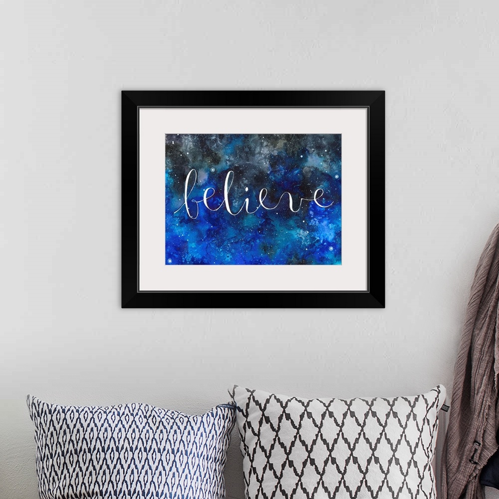 A bohemian room featuring The word "Believe" handwritten on a starry night sky.