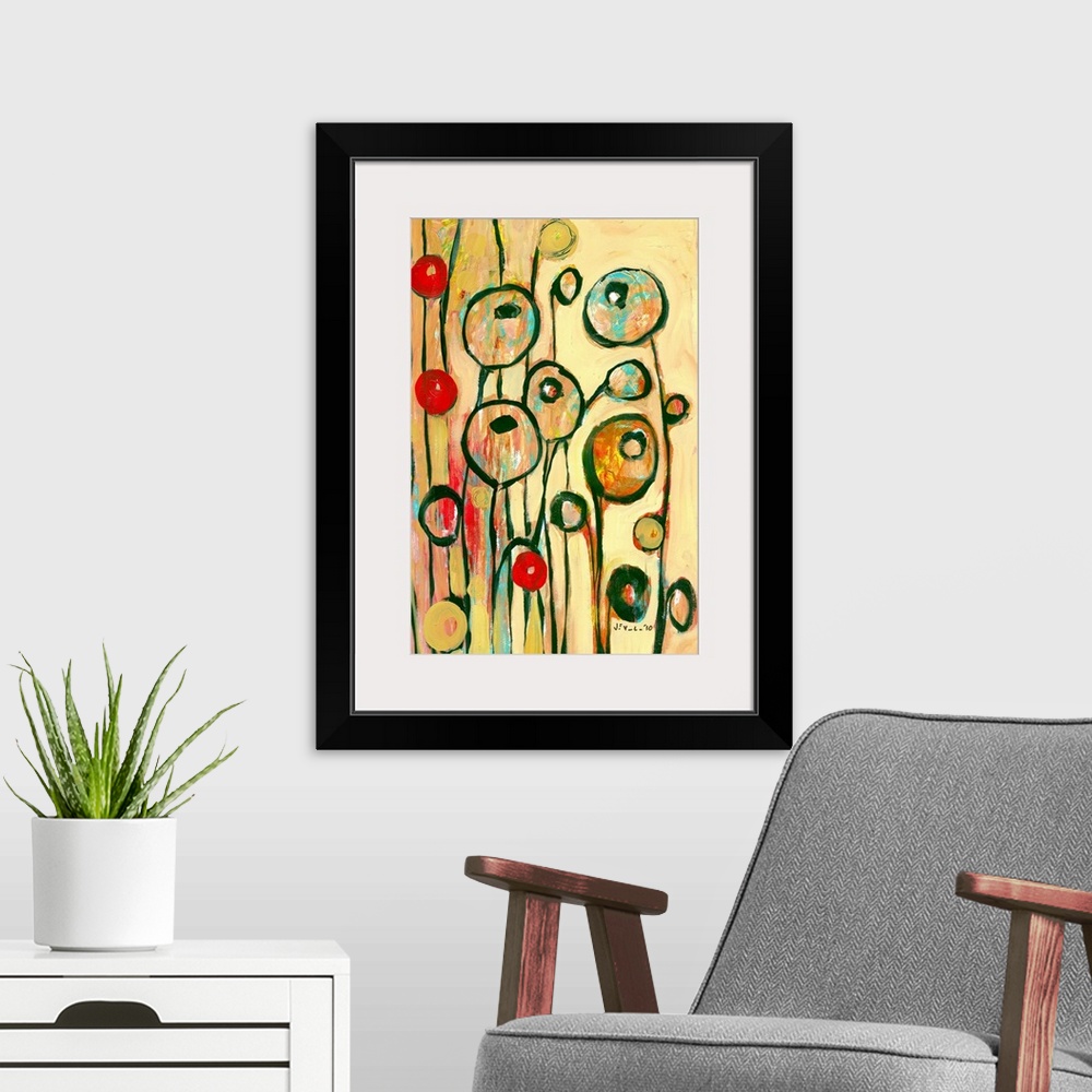 A modern room featuring Large, portrait contemporary art of circular, modern poppy shapes springing upward on a golden, w...