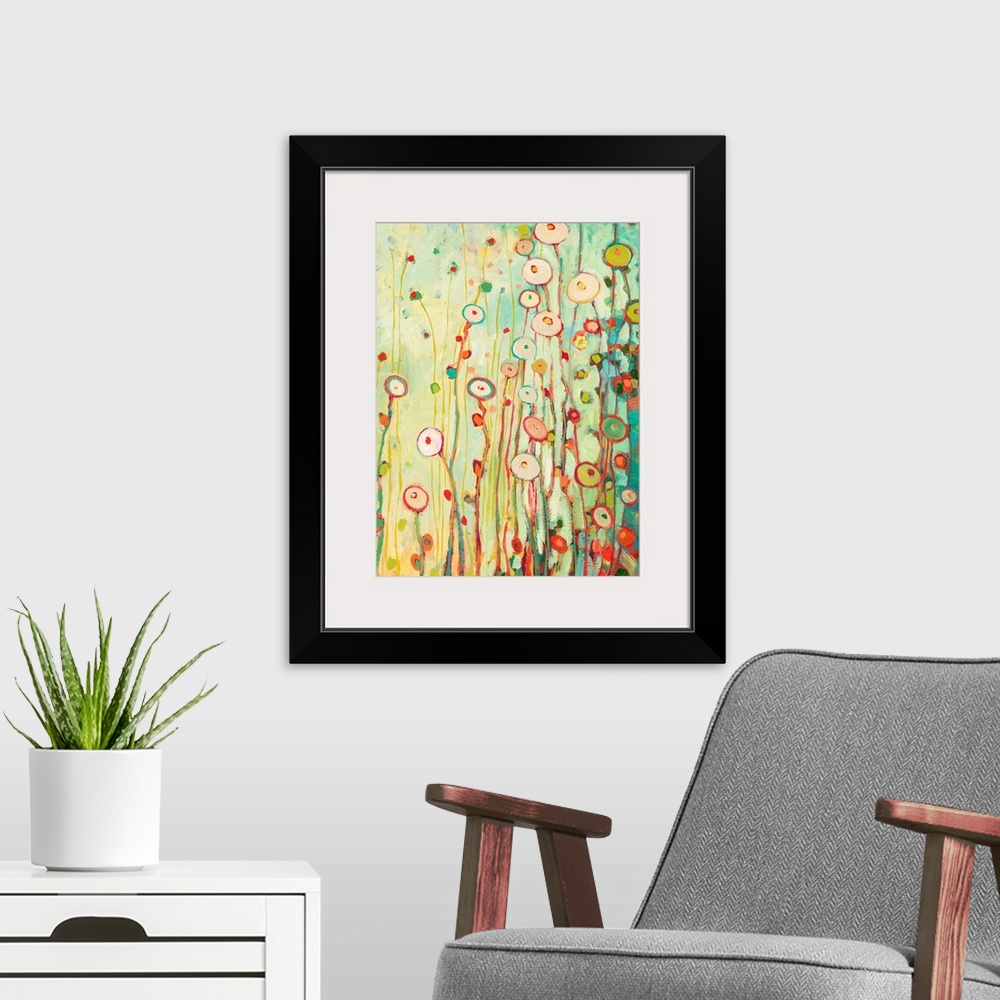 A modern room featuring Bright contemporary painting of tall flowers made from circles.