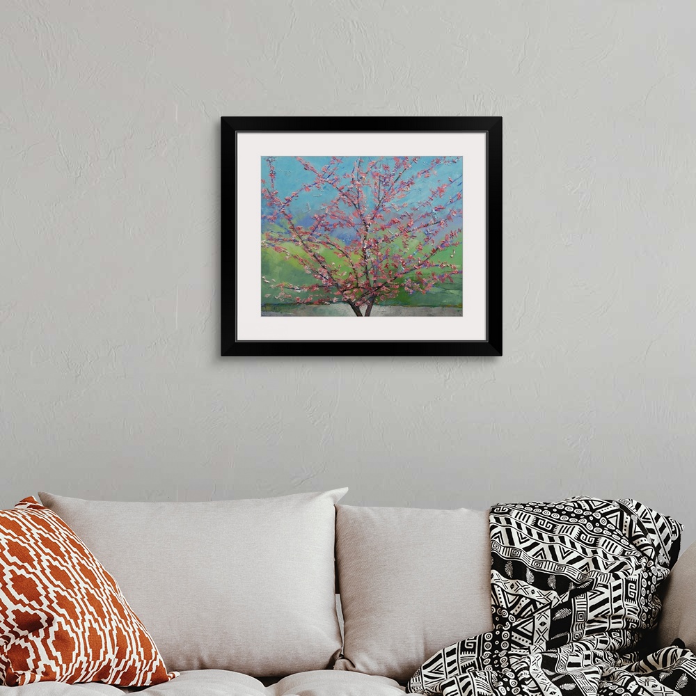 A bohemian room featuring Big floral painting that showcases a close-up of a Eastern Redbud Tree with rough texture.