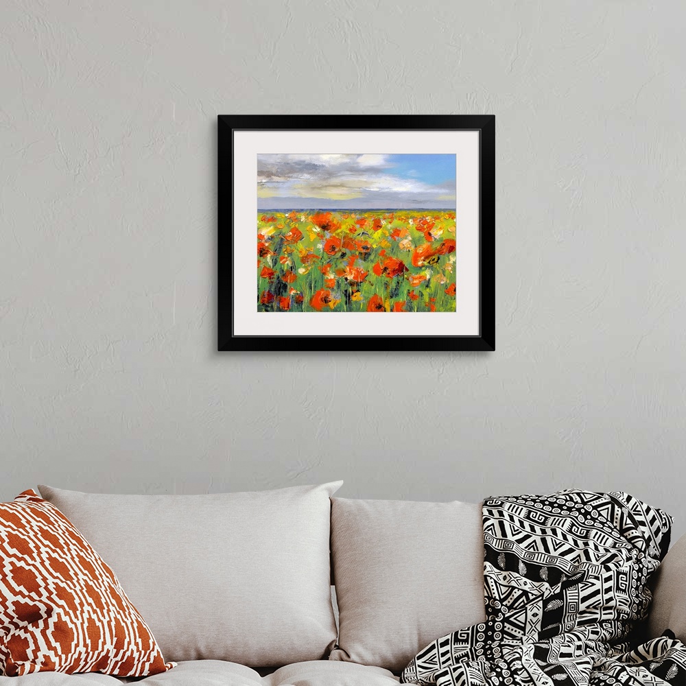 A bohemian room featuring This decorative wall art is a horizontal painting with an endless landscape of wildflowers and cl...