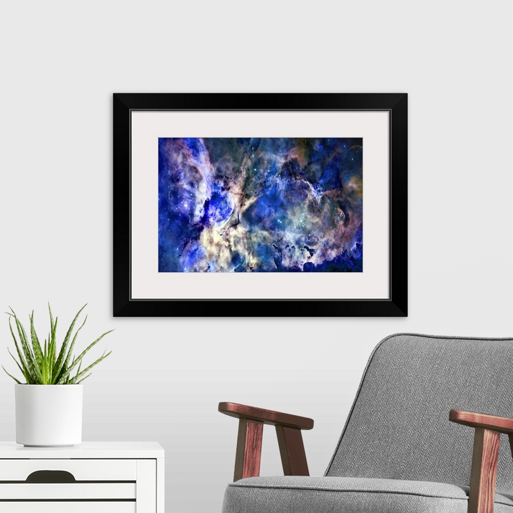 A modern room featuring Big space art showcases a nebula as it surrounds several open clusters of bright stars, two of wh...