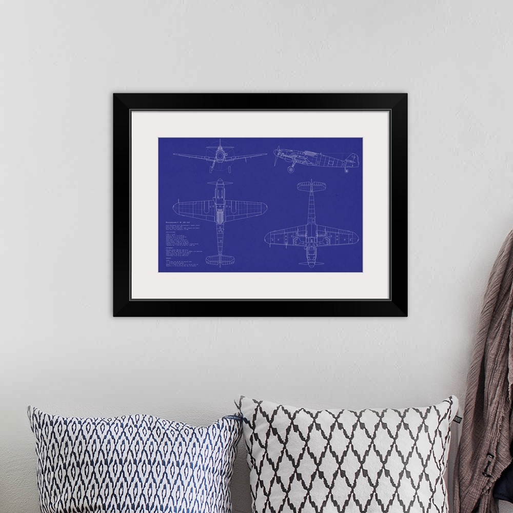 A bohemian room featuring This large piece is a blueprint of a Messerschmitt airplane.