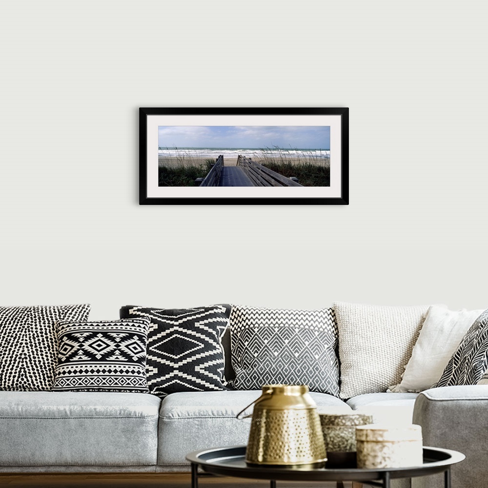 A bohemian room featuring A wide panoramic photograph on canvas perfect for hanging in a living or dining room of a view do...