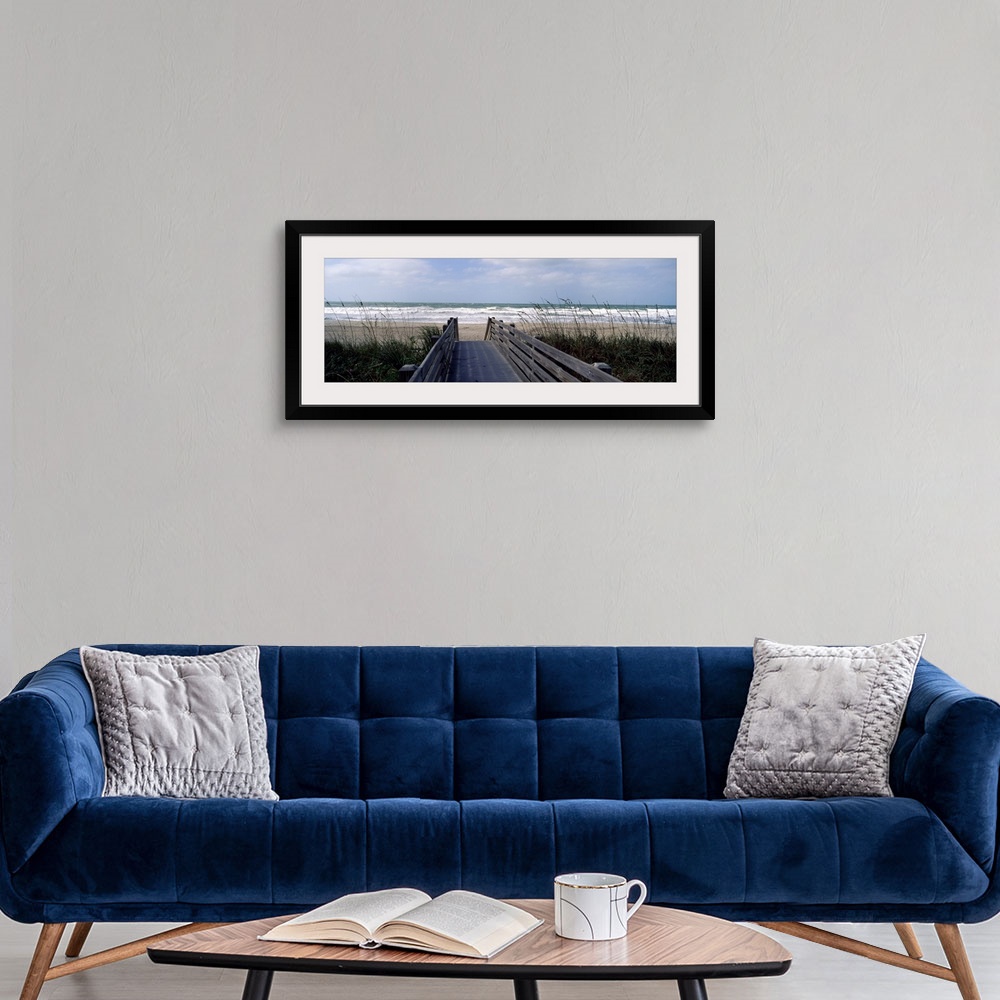 A modern room featuring A wide panoramic photograph on canvas perfect for hanging in a living or dining room of a view do...