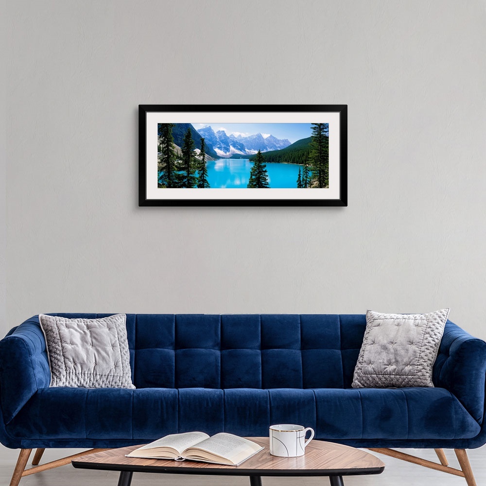 A modern room featuring Panoramic photograph of the Valley of Ten Peaks that is located on Moraine Lake within Banff Nati...