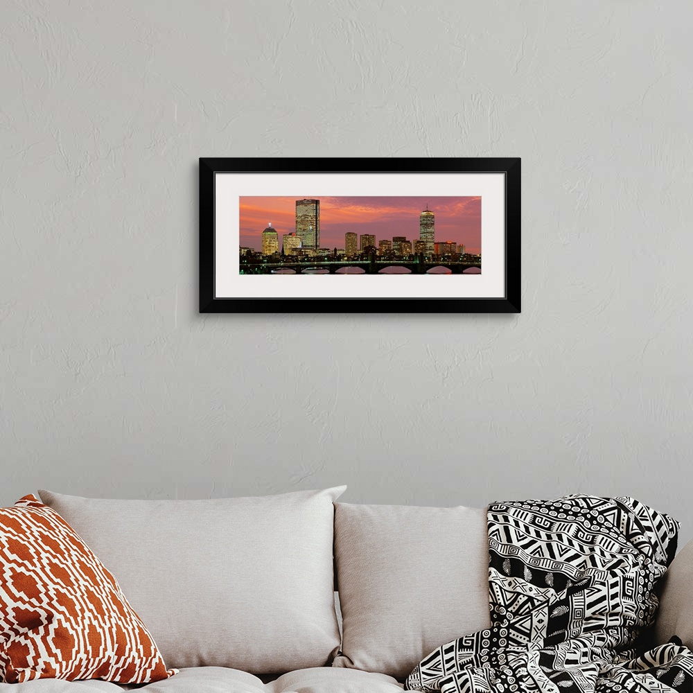 A bohemian room featuring Large horizontal wall picture of the Boston city skyline at dusk with the Charles River Bridge in...