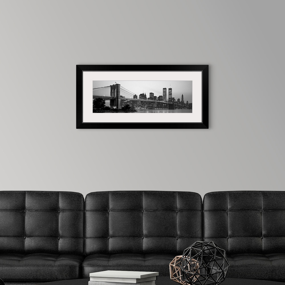 A modern room featuring Panoramic photograph of the Brooklyn Bridge against a skyline filled with skyscrapers in New York...