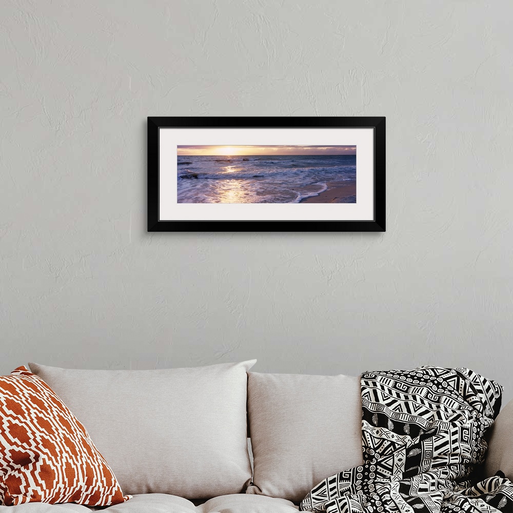 A bohemian room featuring Panoramic photograph of a sunset on a sandy beach in the Gulf of Mexico located within Florida.  ...